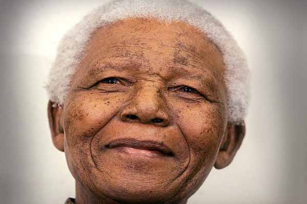 South African official, Mandela better from pneumonia
