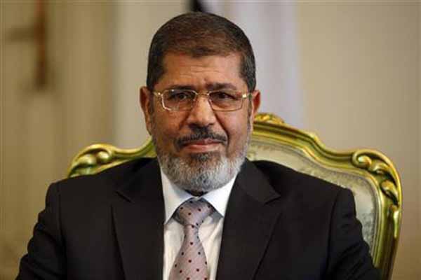 Egypt's Mursi calls elections on April 27