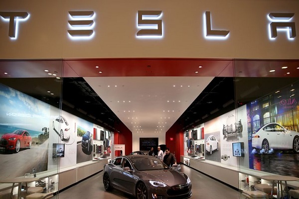 Shares of Tesla Motors jumped and trading volume surged in the final minutes of trading on Wednesday